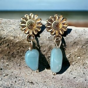 Gold earrings for women with a sun design and light blue natural stones